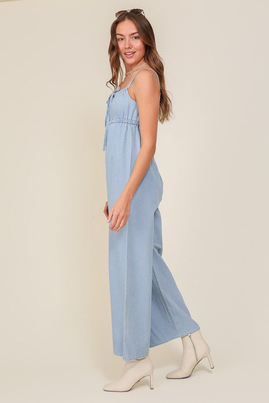 DENIM BLUE SLEEVELESS JUMPSUIT WITH SELF FRONT TIE