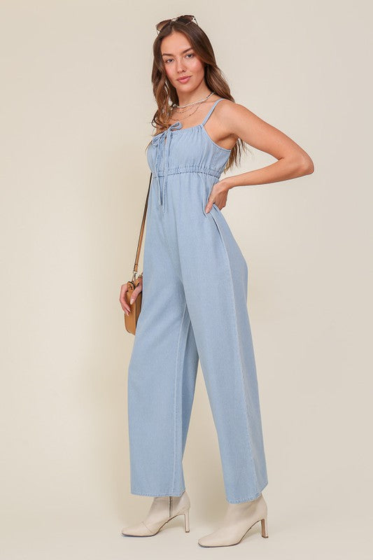 DENIM BLUE SLEEVELESS JUMPSUIT WITH SELF FRONT TIE